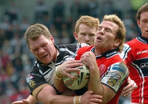 REMEMBER WHEN: Hull KR's Luke Dyer comes under pressure from Hull FC's Danny Tickle (left) during the Super League Hull derby on Easter Monday back in 2007. Picture: Anna Gowthorpe/PA