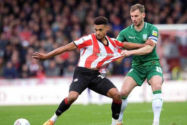 Sheffield Wednesday's Tom Lees battles with Brentford's Ollie Watkins in a Championship clash which took place shortly before the EFL season was suspended due to the coronavirus pandemic. Picture: Steve Ellis.