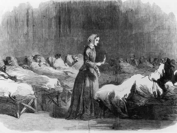 Caption: British nurse Florence Nightingale (1820 - 1910) makes her rounds in the Barrack hospital at Scutari, during the Crimean War, 24th February 1855. (Photo by Illustrated London News/Hulton Archive/Getty Images)