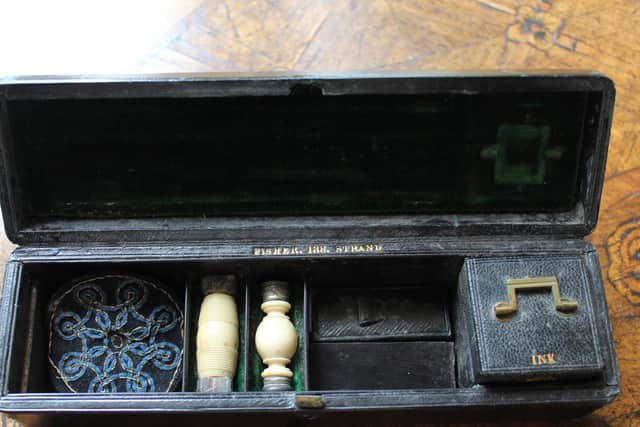 This pen set belonged to Marianne Nicholson. She would have used it to write all her letters to Florence Nightingale when she was young. It contains a pen with nibs, ink, a pen wipe, a seal engraved with MN and a stick for rubbing paper ready for a wax seal.