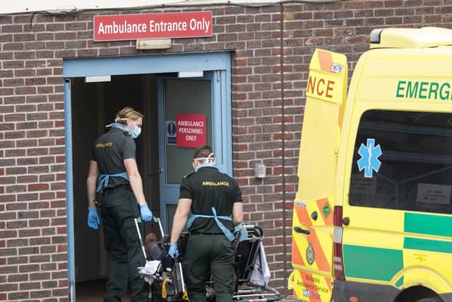 Yorkshire Ambulance Service workers transferring a patient at Doncaster Royal Infirmary. Picture: Danny Lawson/PA