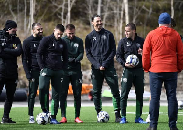 Beating lockdown: AC Milan legendary striker Zlatan Ibrahimovic, centre right, takes part in a training session with the Swedish team Hammarby in Stockholm. Due to the Coronavirus emergency in Italy, Ibrahimovic is in Stockholm to spend time with his family, and is training with Hammarby, a club he has invested in.