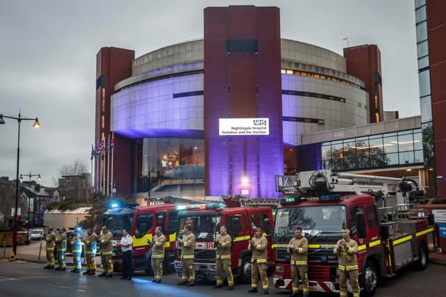 Members of the fire brigade clapping outside the Nightingale Hospital at the Harrogate Convention Centre in Harrogate, to salute local heroes during Thursday's nationwide Clap for Carers NHS initiative to applaud NHS workers fighting the coronavirus pandemic.