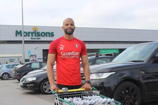 DONATION: Rotherham United's Michael Ihiekwe has delivered hydration drinks to key workers in one of the town's supermarkets