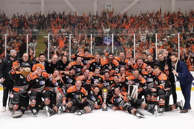 WINNERS: Sheffield Steelers celebrate their 4-3 win in the Chalenge Cup Final against Cardiff Devils in south Wales last month. Picture: Dean Woolley.