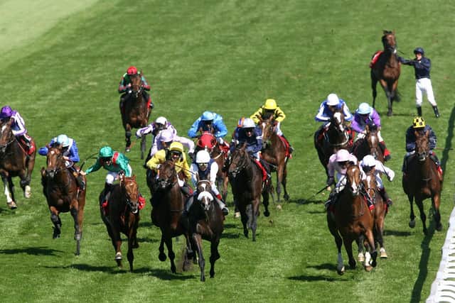 Marcus Tregoning won the 2006 Epsom Derby with Sir Percy (far right).