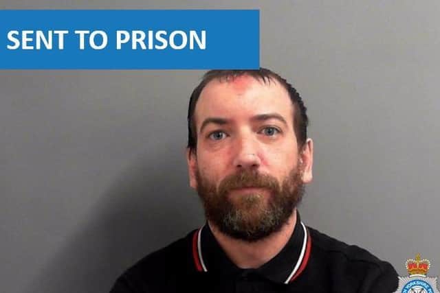The man was sent to prison for threatening to cough at police