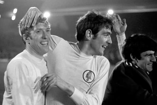 Champions: Leeds United's Mick Jones and Norman Hunter celebrate after wrapping up the League Championship with a 0-0 draw against their closest rivals for the title.