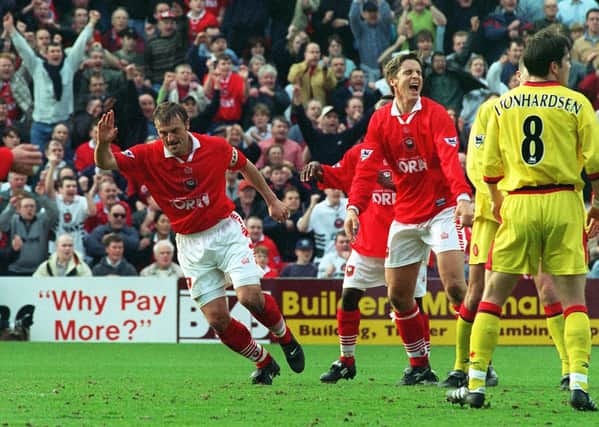 On target: Neil Redfearn celebrates scoring against  Liverpool at Oakwell. Picture: Gary Longbottom