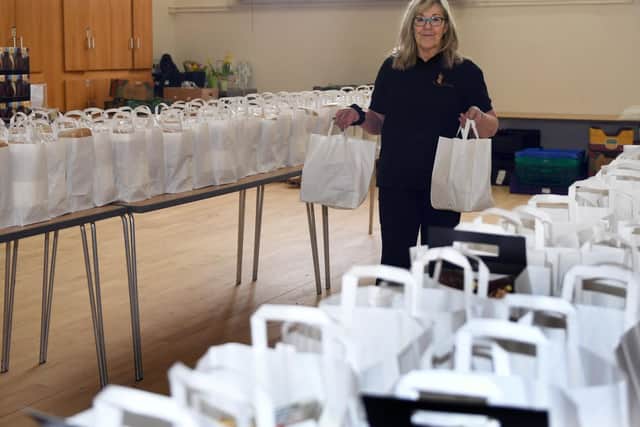 Alison Micallef from St Mary's Church on Bramall Lane in Sheffield filling food parcels to be distributed to the elderly by Age UK Sheffield volunteer. Picture: Gary Longbottom.