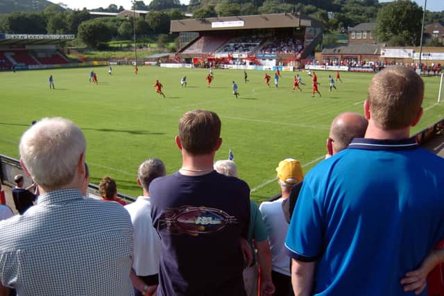 THEATRE OF CHIPS: Home fans watch as Scarborough face Woking at the McCain Stadium at the start of the 2004 season. Picture: Andrew Higgins