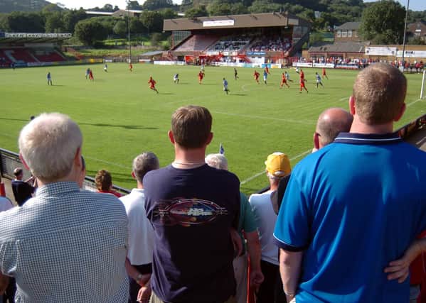 THEATRE OF CHIPS: Home fans watch as Scarborough face Woking at the McCain Stadium at the start of the 2004 season. Picture: Andrew Higgins