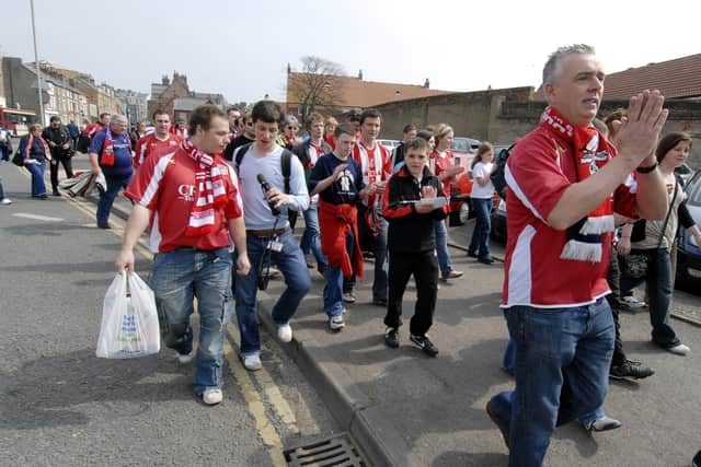 LOYAL: Scarborough FC fans on their 'march of solidarity'  to the McCain Stadium for the cruch game against Leigh on April 21, 2007. It turned out to be the last-ever game at the ground as The Seadogs drew 1-1 and were relegated, the club being dissolved later that summer. Picture: Andrew Higgins.