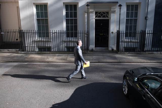 Foreign Secretary Dominic Raab arrives in 10 Downing Street.