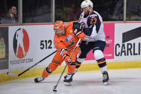 IN THE THICK OF IT: Robert Dowd battles with Guildford Flames’ Corbin Baldwin at Sheffield Arena last season. The 31-year-old Sheffield Steelers' winger saw his season ended early because of a serious shoulder injury. Picture: Dean Woolley.