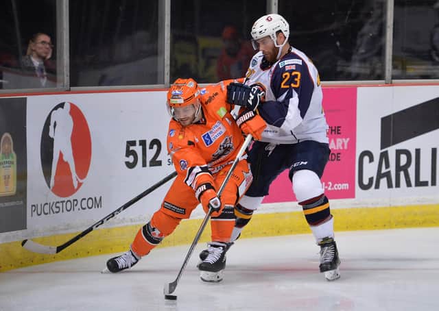 IN THE THICK OF IT: Robert Dowd battles with Guildford Flames’ Corbin Baldwin at Sheffield Arena last season. The 31-year-old Sheffield Steelers' winger saw his season ended early because of a serious shoulder injury. Picture: Dean Woolley.