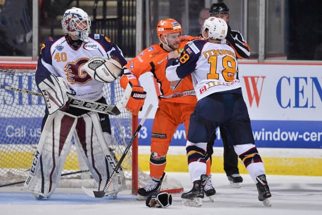 NO HOLDING BACK: Sheffield Steelers' Robert Dowd gets to grips with Guildford Flames’ Brett Ferguson at Sheffield Arena last season. Picture: Dean Woolley.