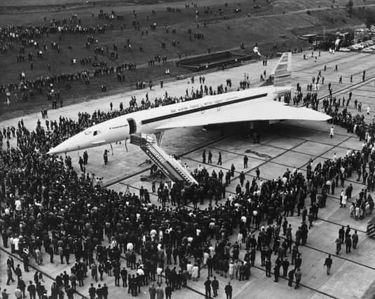 Britain's prototype of the Anglo-French supersonic Concorde airliner being rolled out of its hangar at the British Aircraft Corporation works at Filton, Bristol. Surrounding the aircraft are crowds of BAC employees, who helped with its construction.   (Photo by Fox Photos/Getty Images)