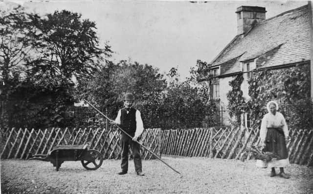 1867:  A Victorian couple tending to the garden of their cottage.  (Photo by Hulton Archive/Getty Images)