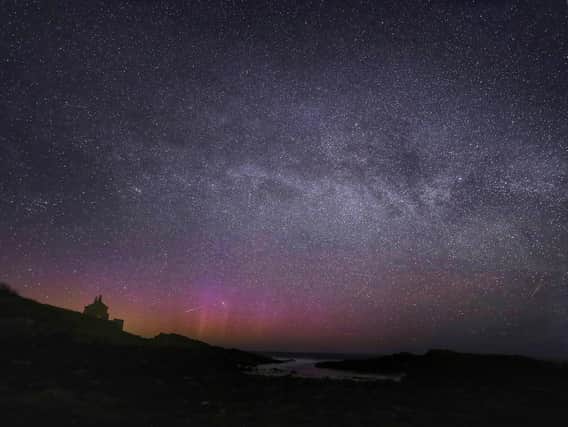 The Northern Lights, the Milky Way and a Lyrid meteor at the Bathing House near Howick, Northumberland Pic:Peter Byrne/PA Wire