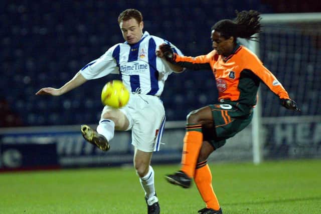 Huddersfield Town's Adi Moses fends off an attack from Argyles Jason Bent.

(Picture: Charles Knight)