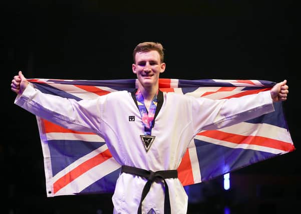 Bradly Sinden celebrates after winning the Men's -68kkg final against Spain's Javier Perez Polo, at the World Taekwondo Championships at Manchester Arena.