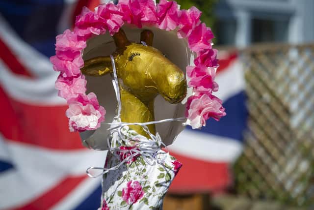 Jill Murray's sculpture Gloria the giraffe, which she is dressing up every day during the lockdown to raise a smile among villagers in Lothersdale, North Yorkshire.