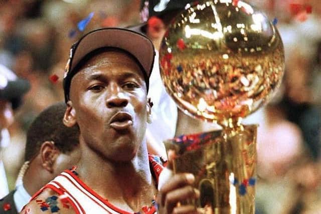 The Last Dance: Michael Jordan of the Chicago Bulls holds the Larry O'Brien Trophy13 June after of game six of the 1997 NBA Finals at the United Center in Chicago, Illinois. Jordan was named the series MVP leading the Bulls to a 4-2 series win over the Utah Jazz.  (Picture: Getty)