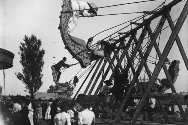 1905:  The swingboats at Southsea Fair, circa 1905.  (Photo by Hulton Archive/Getty Images)