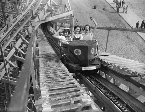 May 1936:  Holidaymakers on a fairground ride at Butlin's in Skegness.  (Photo by Fox Photos/Getty Images)