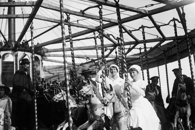 1st September 1917:  Nurses on a carousel during an entertainment day for wounded soldiers at Sidcup.  (Photo by Topical Press Agency/Getty Images)