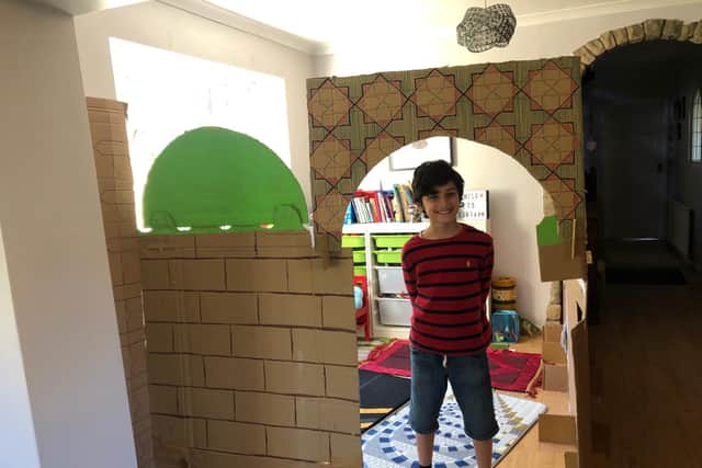 Yahya Murad Hussain has turned his playroom into a mosque using recycled cardboard wrapping that came with his parents' new desks.