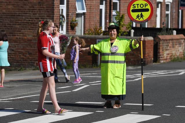 Treeton lollipop lady, Glynnis Bolton, who has done the job for 20 years, celebrating her 65th birthday.