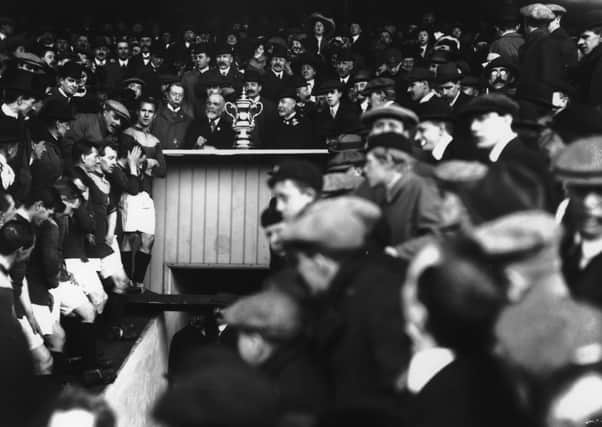 Bradford City players line up for the presentation of the FA Cup after the replay in 1911. Pictures: Getty Images