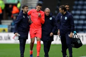 OUT: Huddersfield Town's Tommy Elphick leaves the pitch with an injury against Preston at Deepdale on November 9 which brought an end to his season. Picture: Richard Sellers/PA