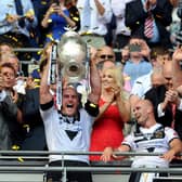 MAGIC MOMENT: 
Hull FC's captain Gareth Ellis lifts the Challenge Cup trophy after beating Warrington Wolves in 2016.
Picture: Jonathan Gawthorpe