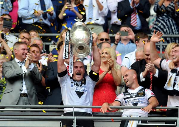 MAGIC MOMENT: 
Hull FC's captain Gareth Ellis lifts the Challenge Cup trophy after beating Warrington Wolves in 2016.
Picture: Jonathan Gawthorpe