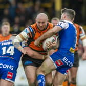 IN THE RUNNING: Castleford Tigers' Nathan Massey crashes into St Helens' Morgan Knowles and Lachlan Coote earlier this season.  Picture: Tony Johnson