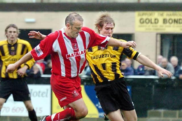 JOURNEYMAN: Neil Redfearn, pictured in action for Scarborough battling with Harrogate's Chris Mason.