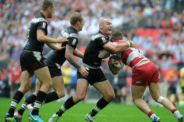ONE TO FORGET: Gareth Ellis battles with Josh Charnley in the 2013 Challenge Cup Final, a desperately disappointing day for Hull FC when they lost to Wigan. Picture: Bruce Rollinson