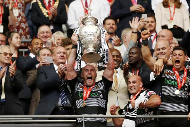 SAME AGAIN: Hull FC's Gareth Ellis lifts the 2017 Challenge Cup trophy at Wembley. Picture: Paul Harding/PA.
