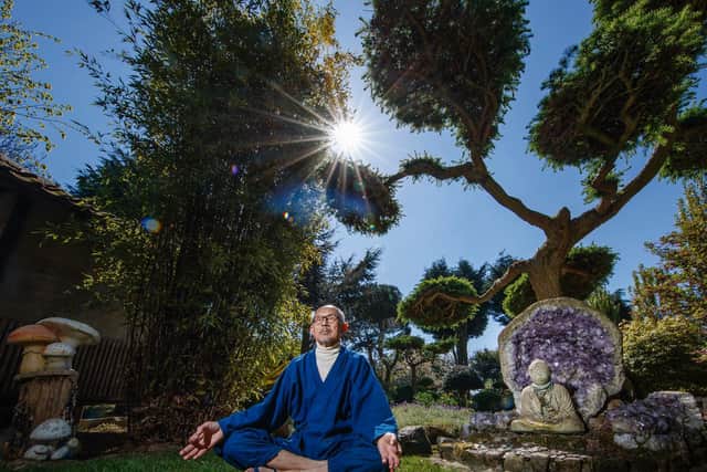 Former Buddhist monk Buddha Maitreya, who says the pandemic is a warning to humanity, in his award winning Japanese Garden at the Pure Land Meditation Centre near Newton on Trent.