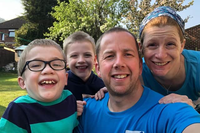Sam Brown, brother Alex, dad Simon and mum Katy completed London Marathon distance by doing 874 laps of their garden in Otley to raise funds for the MPS Society