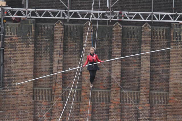 HIGH-FLIER: Helen Skelton walks the tightrope between two of the chimneys at Battersea Power Station, London, in support of Red Nose Day 2011. Picture: Andy Paradise/Comic Relief/PA