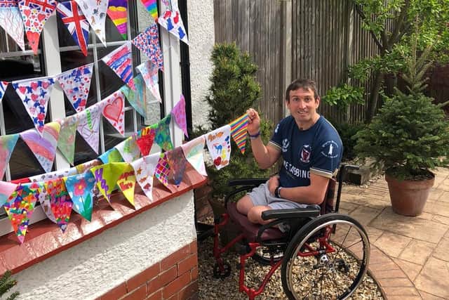 Ben Parkinson with bunting he's created. Picture: BBC