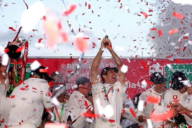 Triumph: England captain Michael Vaughan lifts the Ashes in 2005.