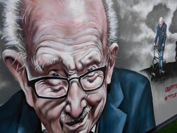 A mural that has been created to pay tribute to NHS fundraiser Captain Tom Moore outside Bradley Scott Windows in Tamworth, Staffordshire. Jacob King/PA Wire