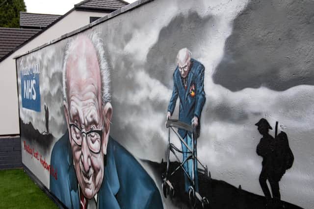 A mural that has been created to pay tribute to NHS fundraiser Captain Tom Moore outside Bradley Scott Windows in Tamworth, Staffordshire. Jacob King/PA Wire