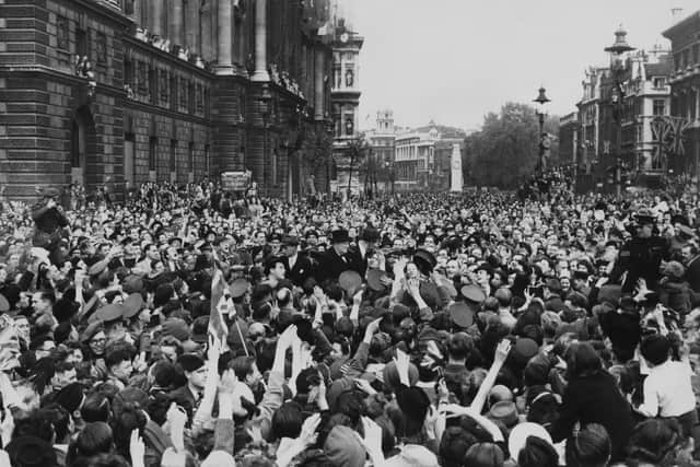 Winston Churchill crosses Parliament Square on VE Day in 1945.