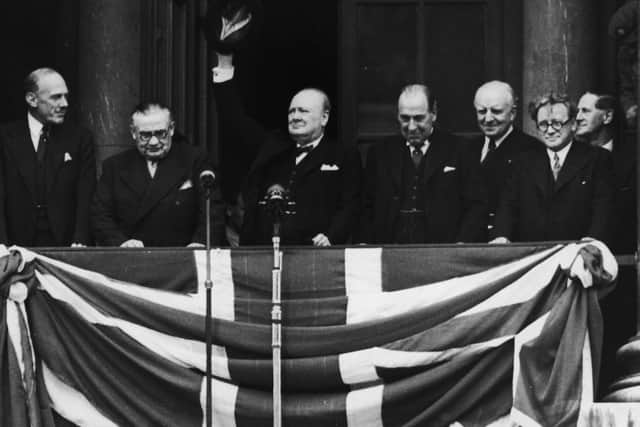 Winston Churchill addresses the crowds from the Ministry of Defence on VE Day in 1945.